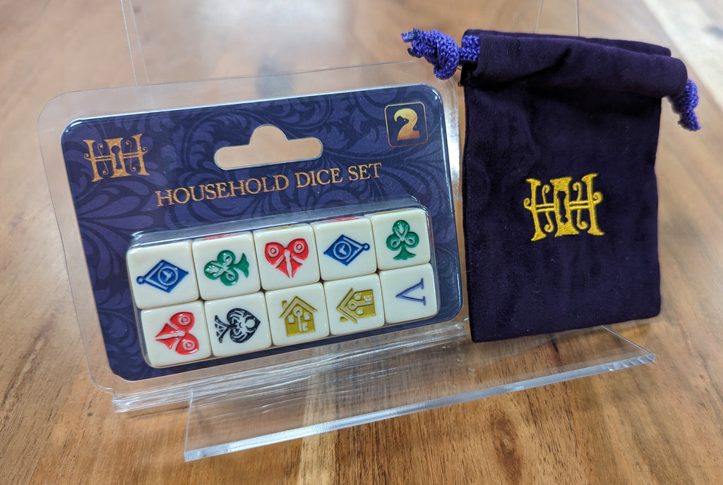 10 dice with custom symbols and velvet bag with gold embroidery of the Household logo.