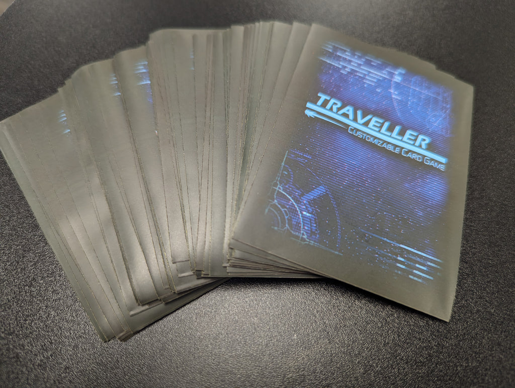 Card sleeves with the Traveller font and blue background, "Traveller: Customizable Card Game"