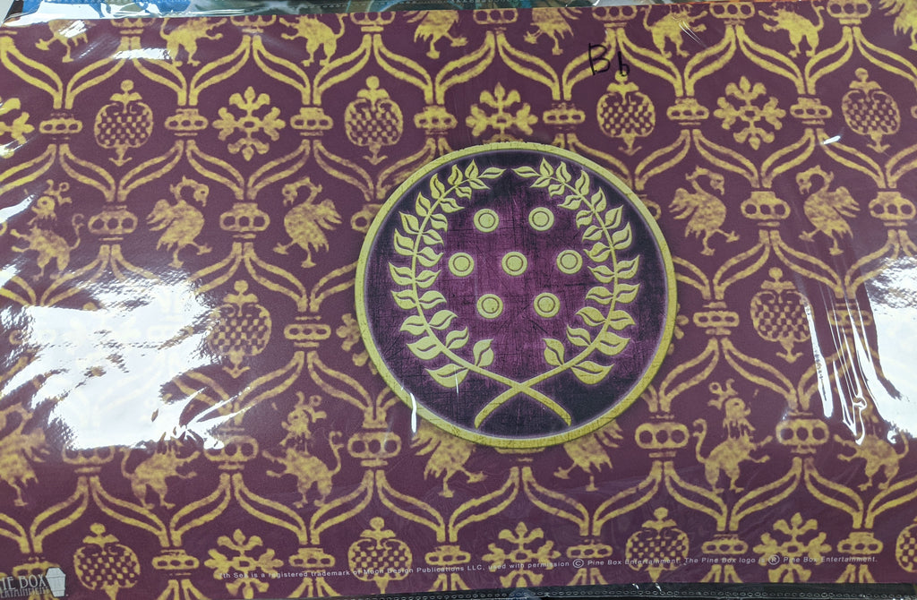 Maroon back ground with yellow design. Center of the playmat is a laurel wreath surrounding 7 yellow orbs.