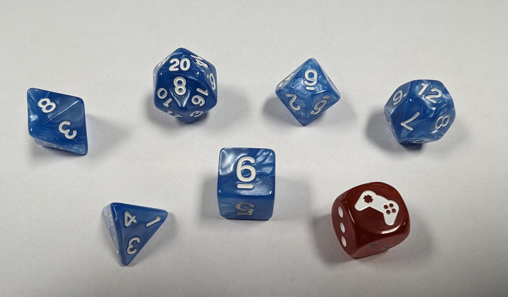 A marbleized blue and silver 6 Die Set with white numbers featuring a D20, a D12, a D10, a D8 , a D6 and a D4 plus 1 red and white piped D6 Wild Die with a game controller on the 6 side. 